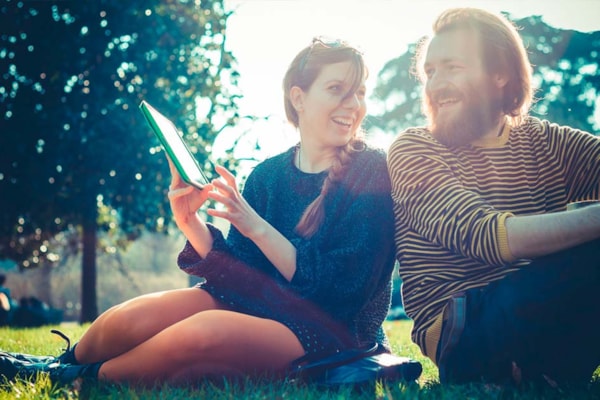 Couple in a park, in the sun